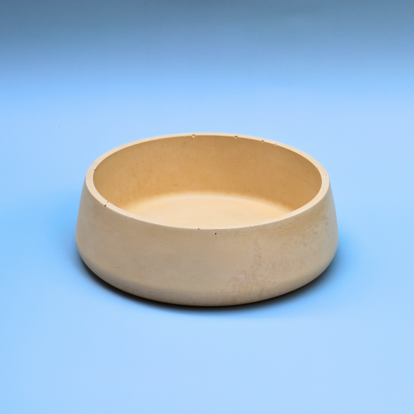 Small beige concrete bowl