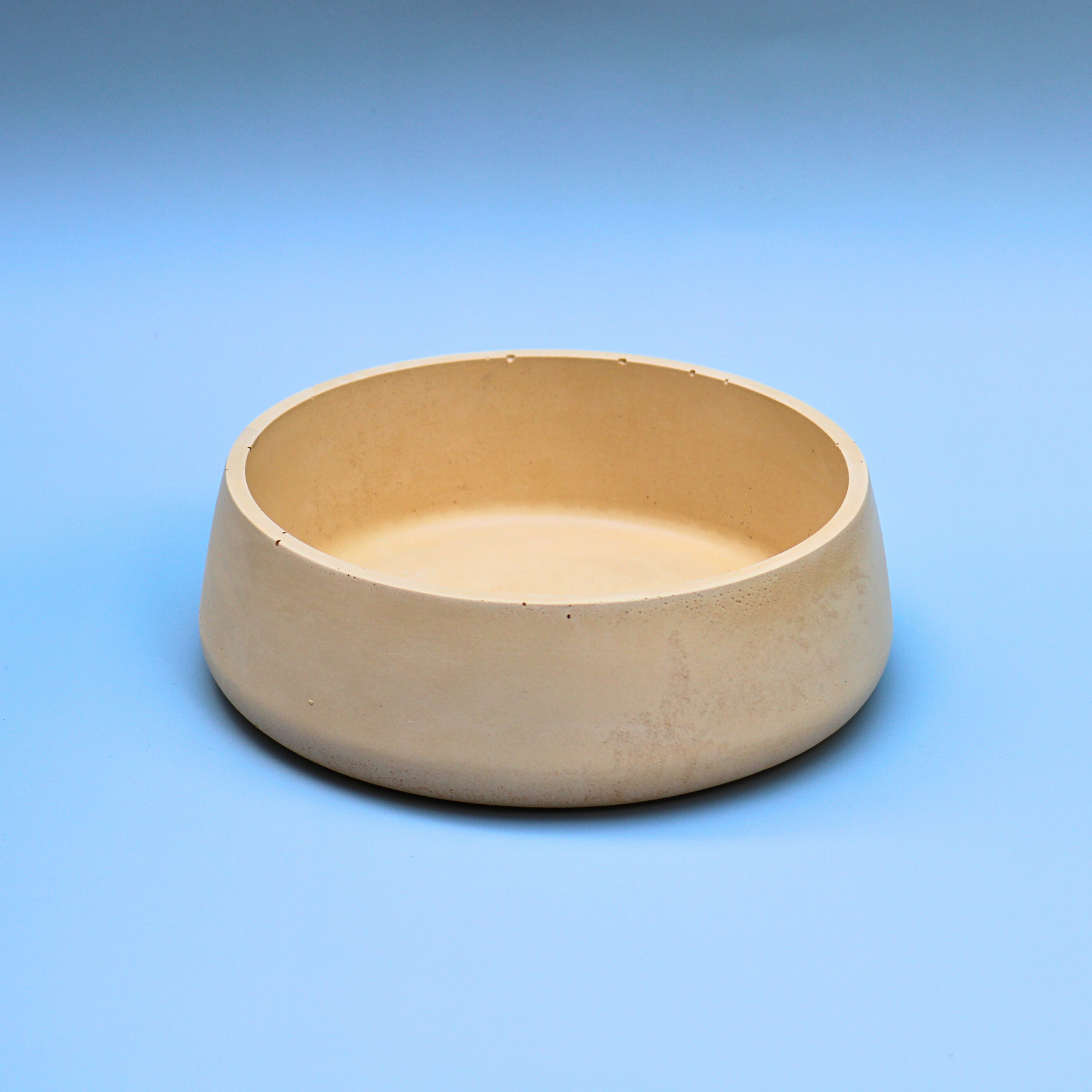Small beige concrete bowl