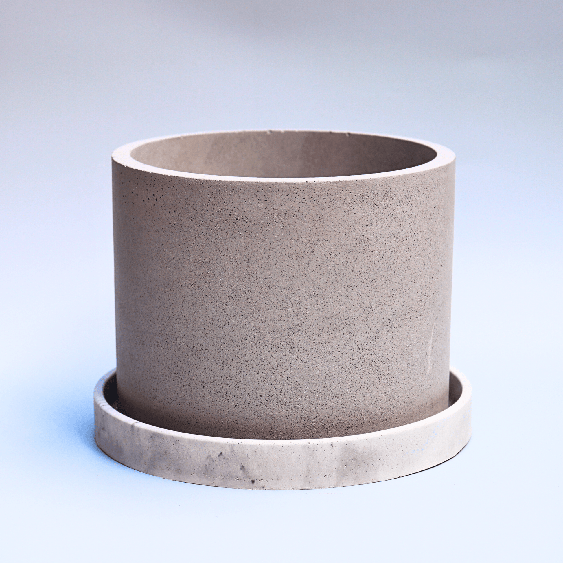 Grey planter with a tray